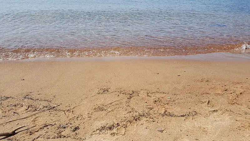 Clear Lake Superior water over a sandy and pebbly shore