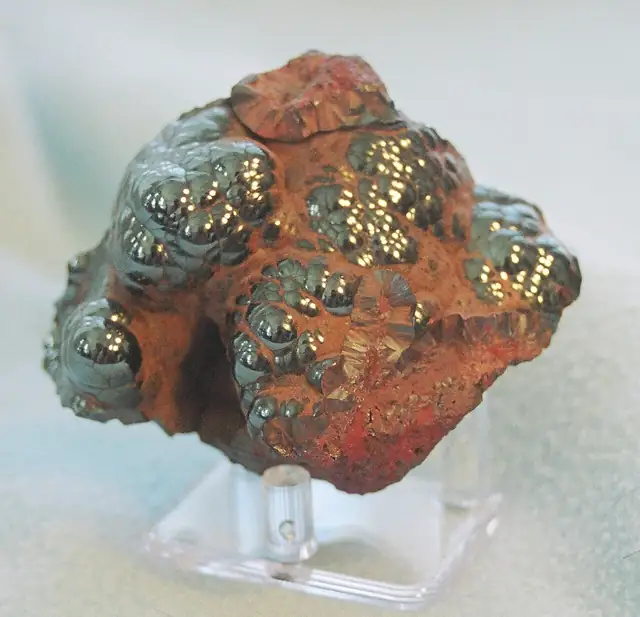 Kidney ore (botryoidal hematite) from Michigan, locality unknown. The yellow spot is lamp glare