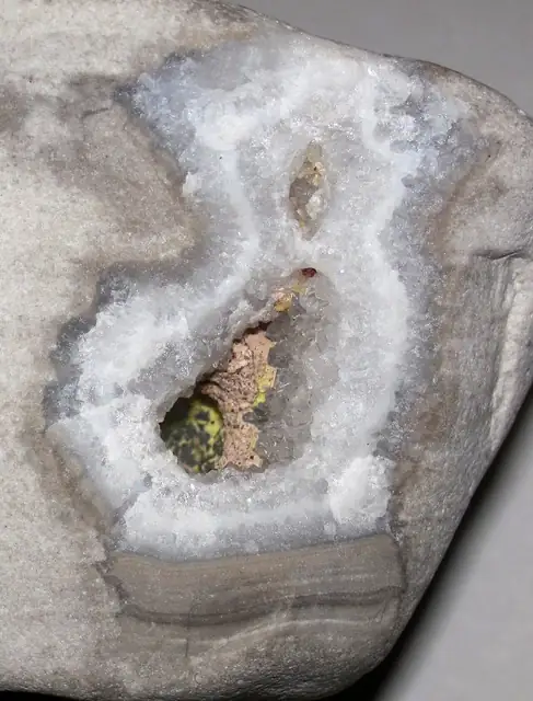 Beach cobble with a hollow lined with quartz crystals, Lake Superior shoreline, Upper Peninsula